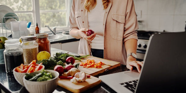 Habits for a Lighter You woman at computer with fruits